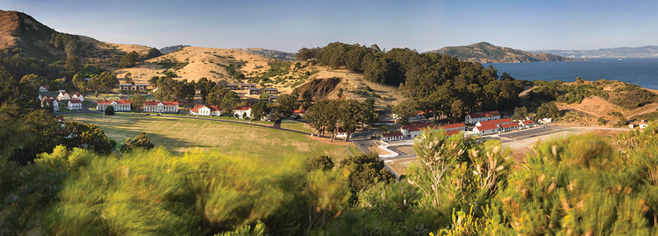 Fort Baker Retreat Group Cavallo Point Lodge & Spa, Sausalito, CA: Hospitality renovation and new construction by Herrero Builders in a historic landmark, with Leddy Maytum Stacy Architectural Resources Group. Site view of the lodge campus across a grassy valley toward the bay.