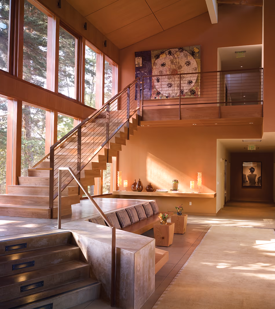 Fort Baker Retreat Group Cavallo Point Lodge & Spa, Sausalito, CA: Hospitality renovation and new construction by Herrero Builders in a historic landmark, with Leddy Maytum Stacy Architectural Resources Group. Interior view of a wood staircase beside a glazed wall and a seating alcove.