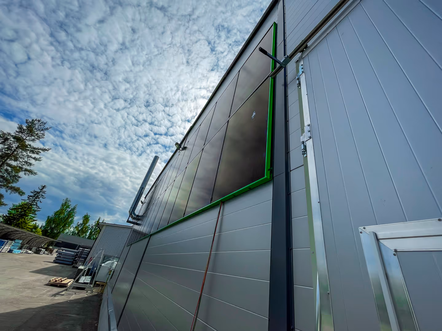 RAULI WALL green mounting system on a warehouse wall