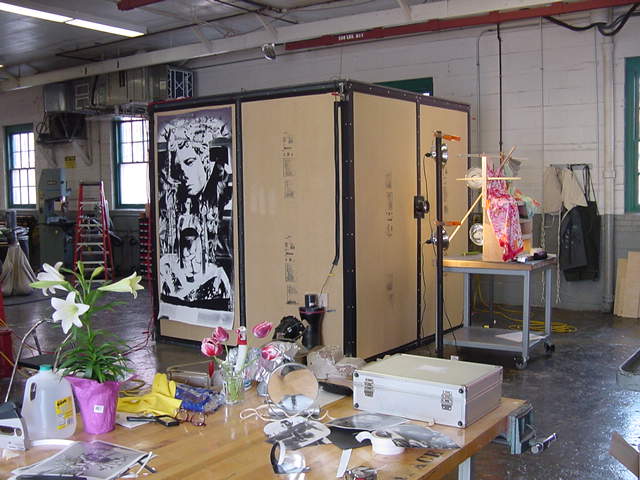 L to R: George Woodman’s studio space at Grand Arts, 2004 / Installation views at Grand Arts, 2004 / George Woodman. Chinese Chrysanthemums and the Chaos of Love, 2004. 64 1/4 x 39 1/4 in. Gelatin silver print / George Woodman. Ruth, Baby, Saskia, et al., 2004. 65 3/4 x 39 3/4 in. Gelatin silver print.