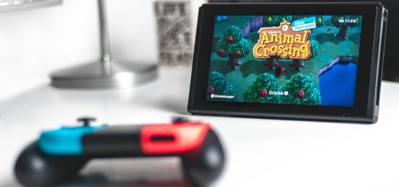 Nintendo Switch with Animal Crossing on screen.