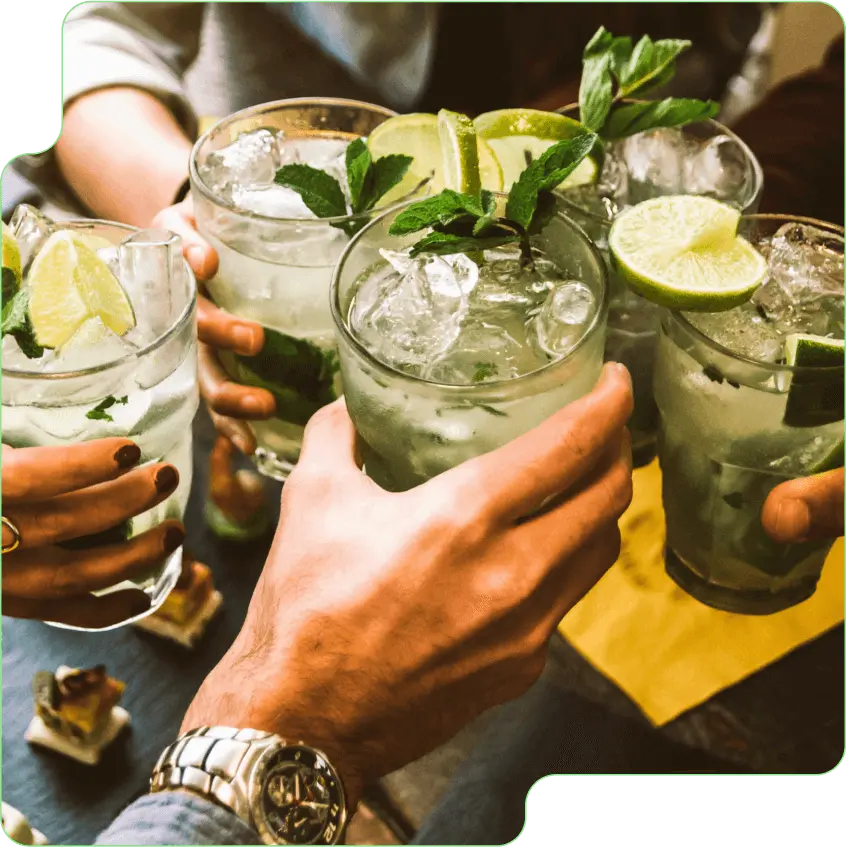 Group of hands clinking their drinks together