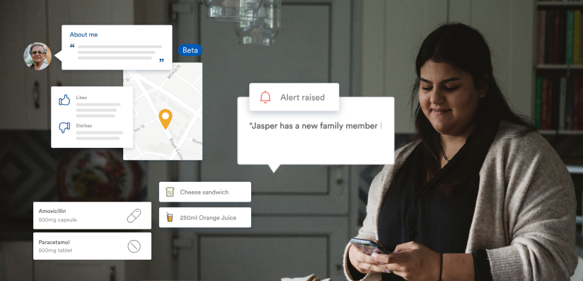 Woman in kitchen on mobile phone logs details of care