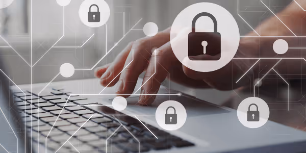 Zoomed in view of a person typing with a locked symbol, depicting GDPR and data protection when using care management software