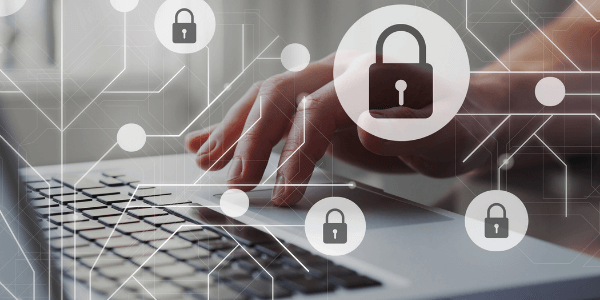 Zoomed in view of a person typing with a locked symbol, depicting GDPR and data protection when using care management software
