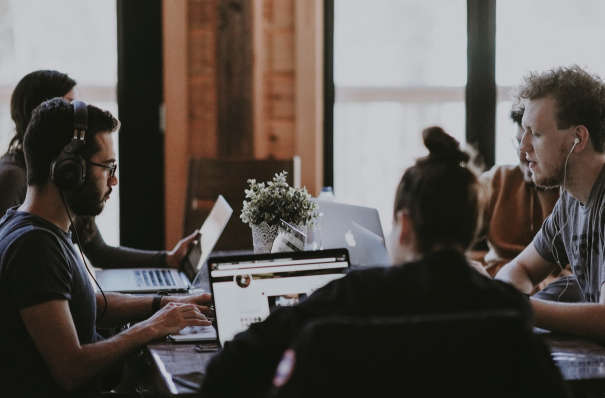 A group of people working together in an office