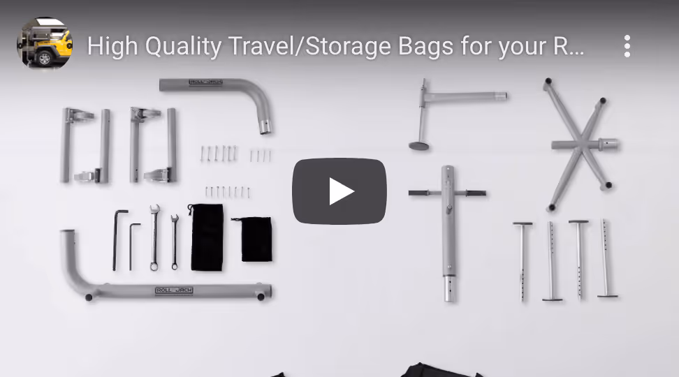 Disassembled metal parts, tools, and screws neatly arranged on a white surface for a Roll Jack vehicle accessory.