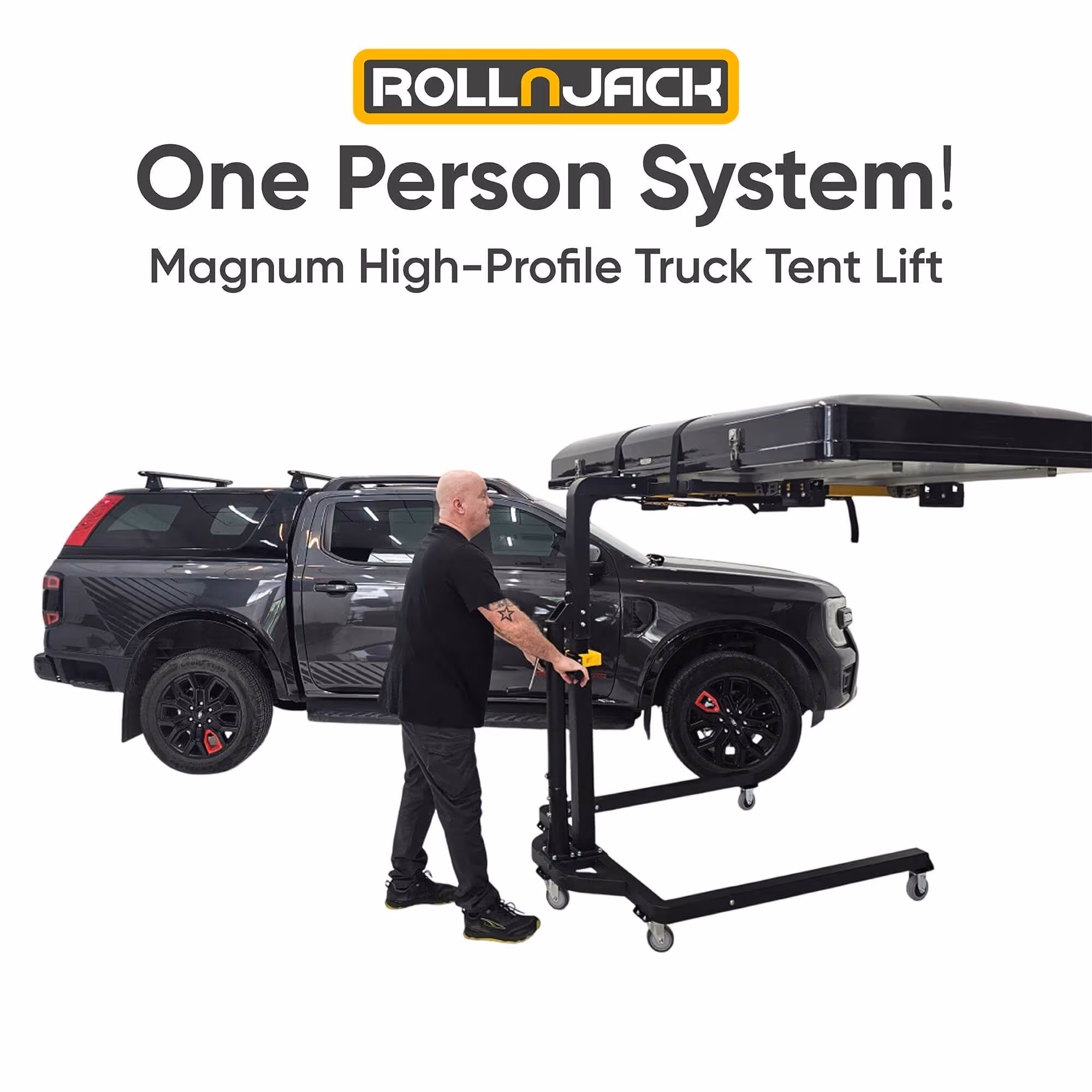 Man operating Roll-N-Jack Magnum High-Profile Truck Tent Lift next to a dark gray pickup truck.