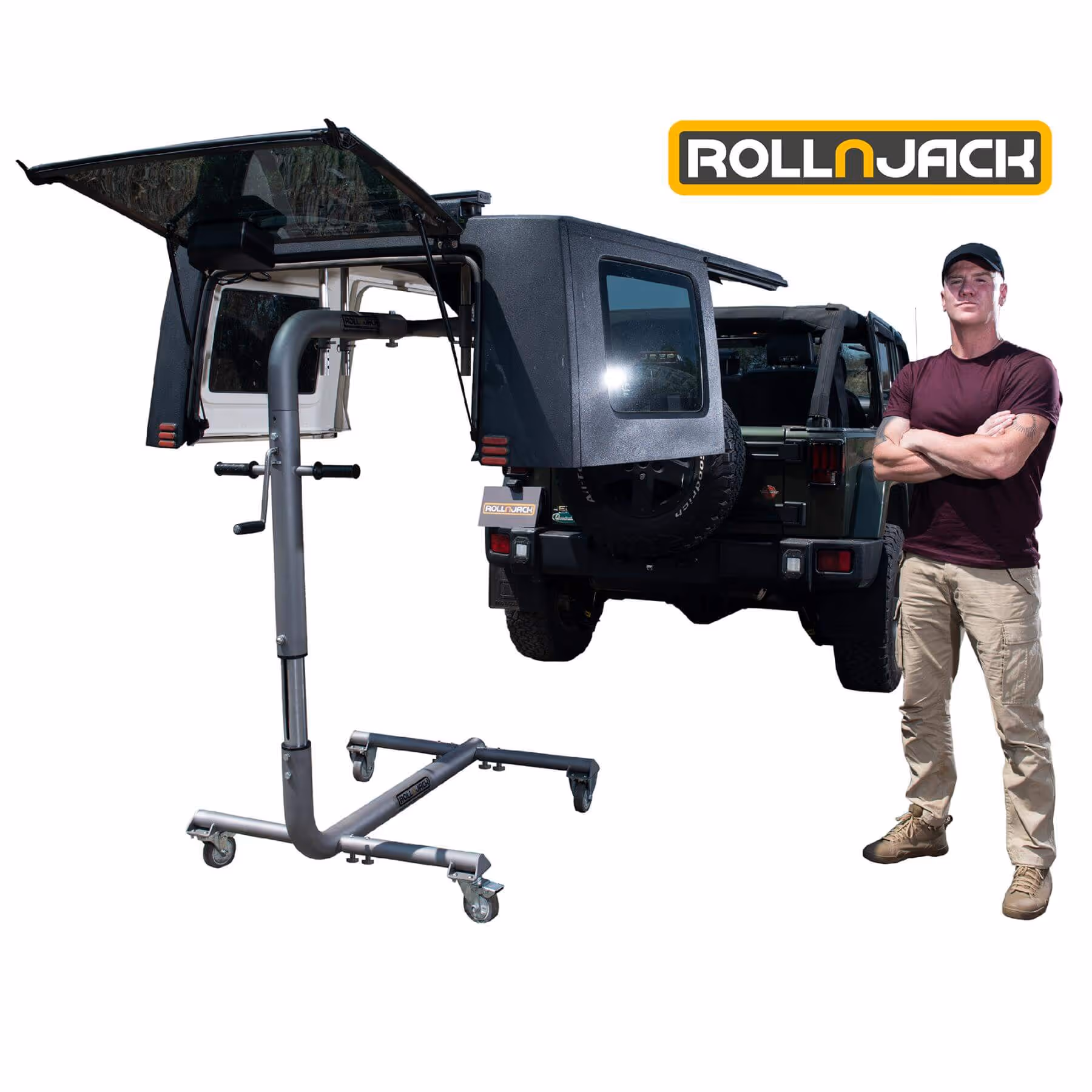 Man standing with arms crossed next to a Jeep with a hardtop mounted on a wheeled RollnJack lifting frame.