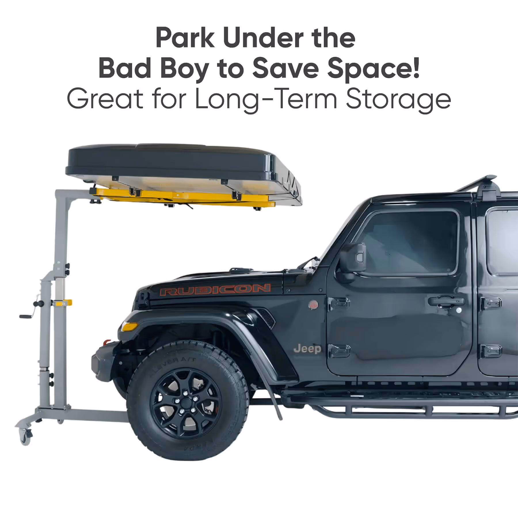 Black Jeep Rubicon parked under an elevated storage platform on a lift, demonstrating space-saving long-term storage.