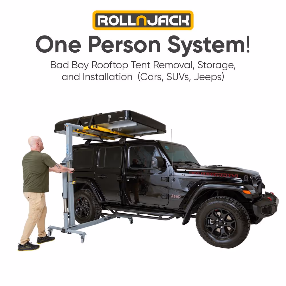 Man operating a RollnJack rooftop tent removal system lifting a rooftop tent off a black Jeep Rubicon.