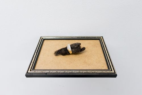 Self Portrait, 2023. Hair, gold and diamond ring, and frame. Photography by Jonny Tanna, images courtesy the artist and Harlesden High Street.