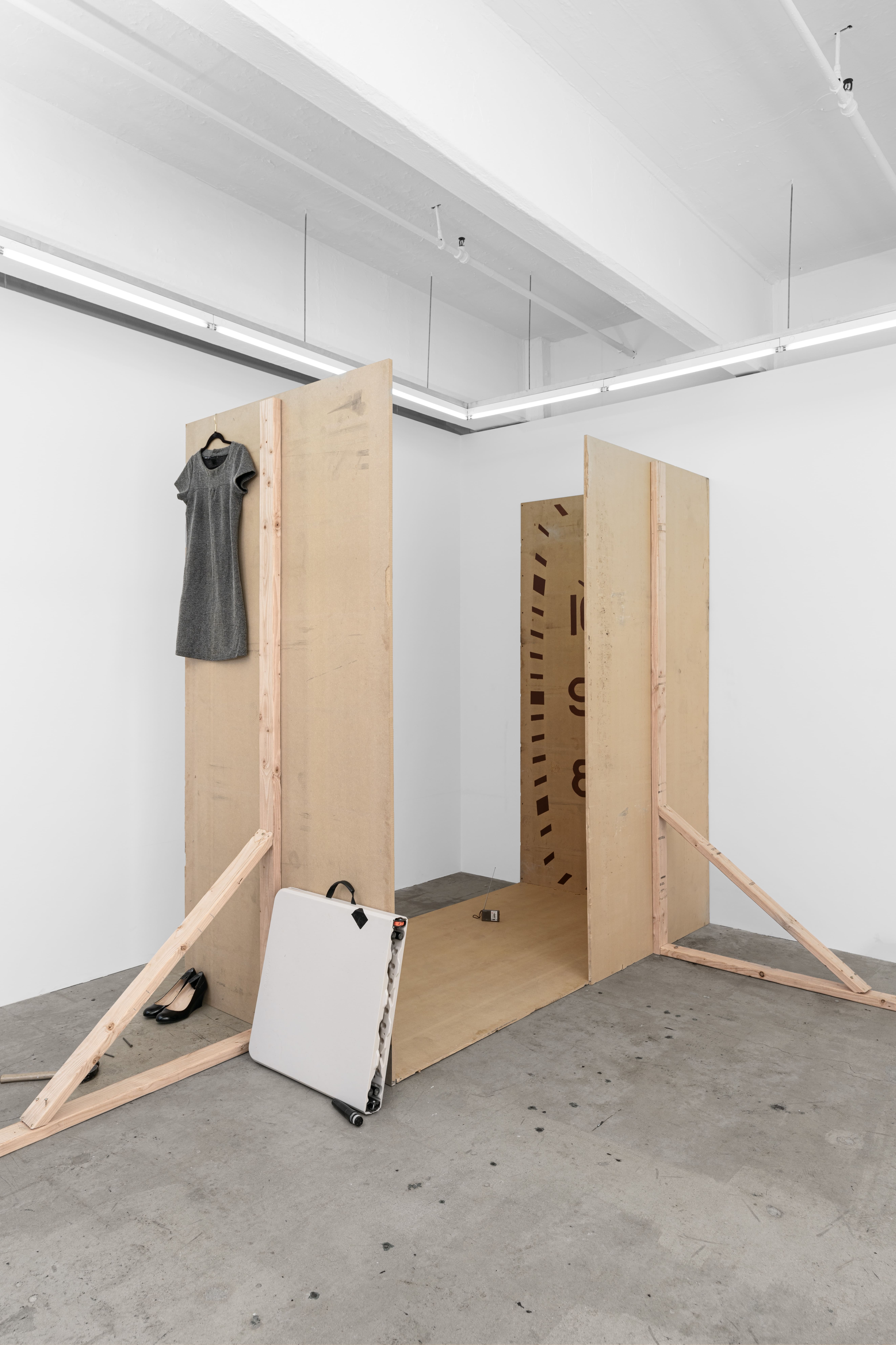 Stage, 2025 MDF board, wood, screws, marker, oil-based enamel, tape, headphones, table, DJ mixer, laptop, nails, microphone, folding table, bag, dress, radio, shoes, water, cables, hammer