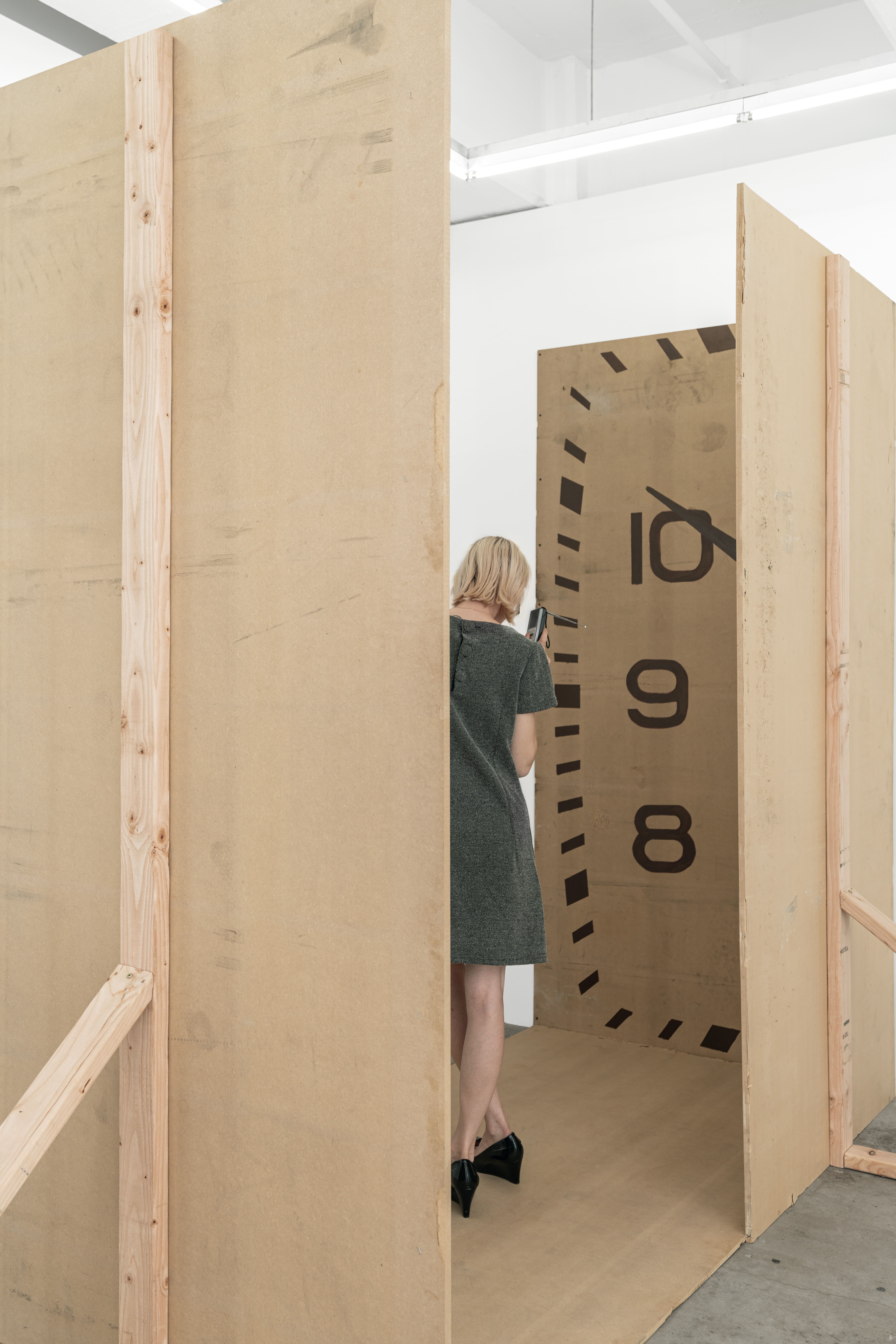Stage, 2025 MDF board, wood, screws, marker, oil-based enamel, tape, headphones, table, DJ mixer, laptop, nails, microphone, folding table, bag, dress, radio, shoes, water, cables, hammer