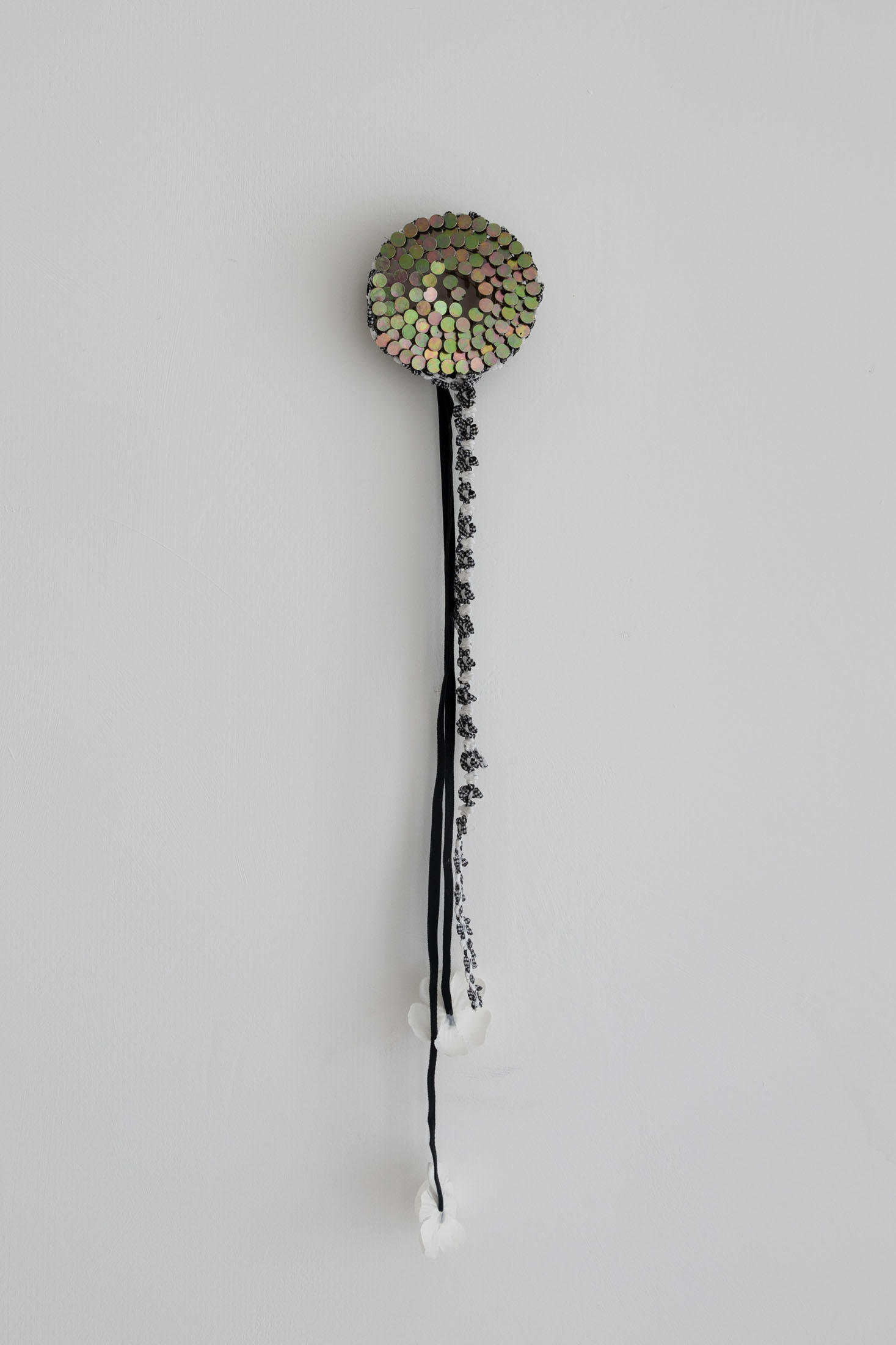 Lorenza Longhi, Corsage (B&W), 2025, coil nails, trimmings, fake flower petals, glue, Ø 10 cm, Courtesy of the artist & Fanta MLN