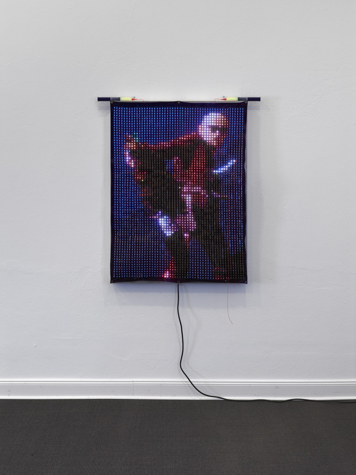 Ei Arakawa-Nash, Jürgen Klauke, ROT, 1974 (detail), 2025, 3.588 LEDs (WS2813, 60 LEDs/m, black) on hand-dyed fabric with grommets and eyelets, K8000C controller, 2GB SD card with LedEdit 2014 files, 5 x 5V 80A power supply with 22 AWG stranded wire, custom aluminum case, 122 x 91 x 9 cm