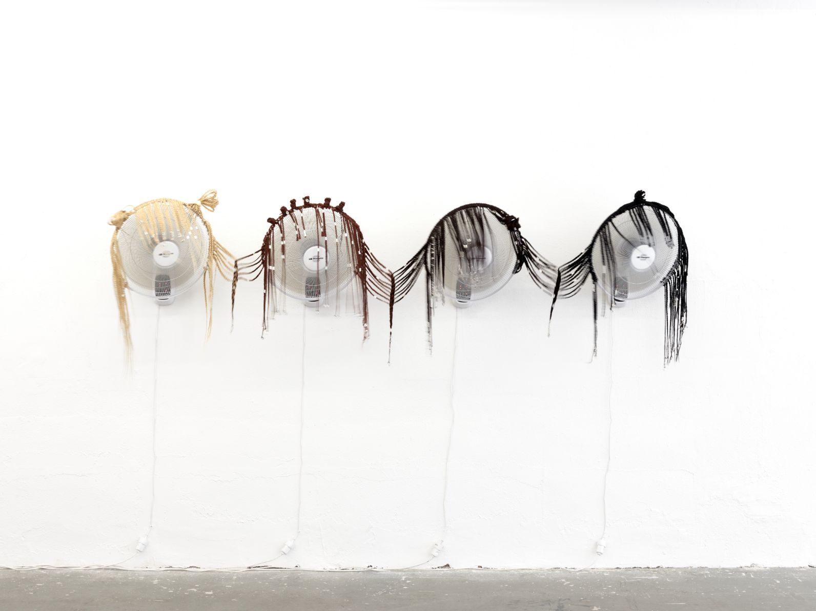 Monsieur Zohore, Wirbelsturm Marianne, Susanne, Sabine, Hildegard, 2025, braided synthetic hair on ventilators, hair accessories, dimensions variable, photo: Ladislav Zajac. Courtesy of KOW