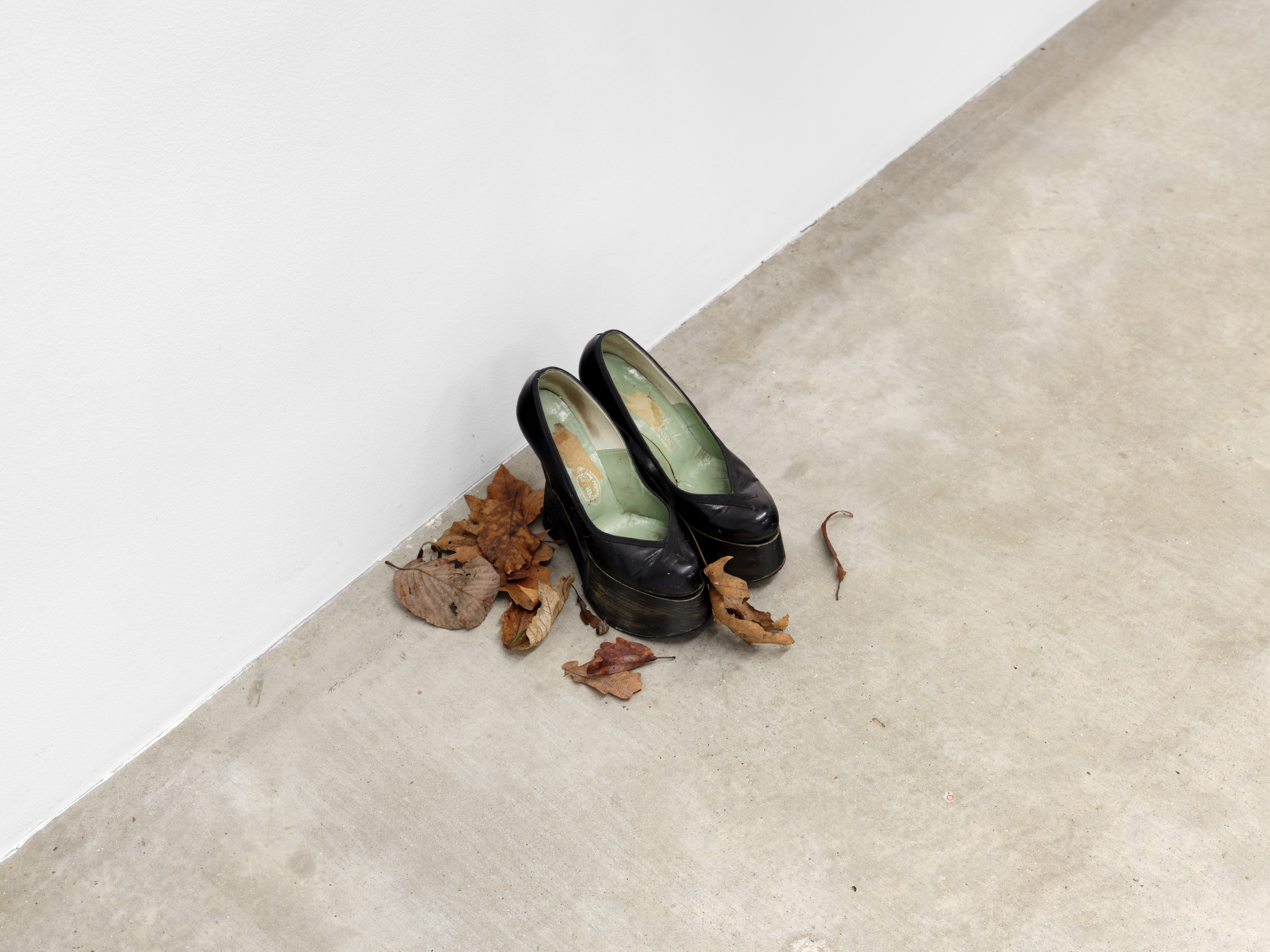 Women’s History Museum, Vixen I Last, 2025, 1940s leather shoes, wood, Dimensions variable. Courtesy of the artist and Soft Opening.