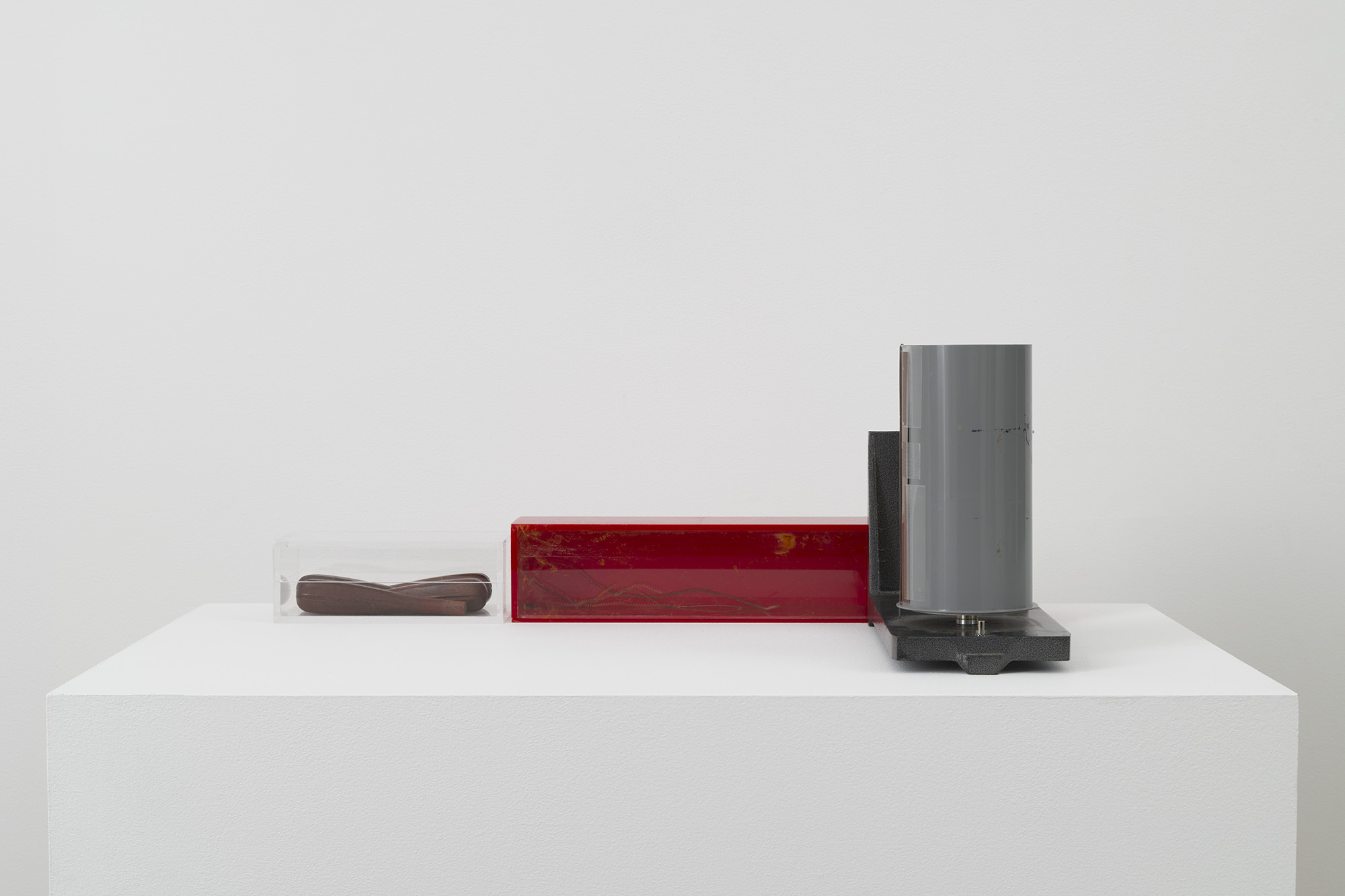 Craig Jun Li, As She Puts It, “One Big Ruin”, 2023/2026, Decommissioned weekly thermo-hygrograph (AA battery powered), expired Kodak Polymax II RC F photo paper, medical tape, plexiglass, wood, rusted instrument string, 9 x 28 x 15 1/2 in (22.9 x 71.1 x 39.4 cm). Courtesy of the artist and Chapter NY.