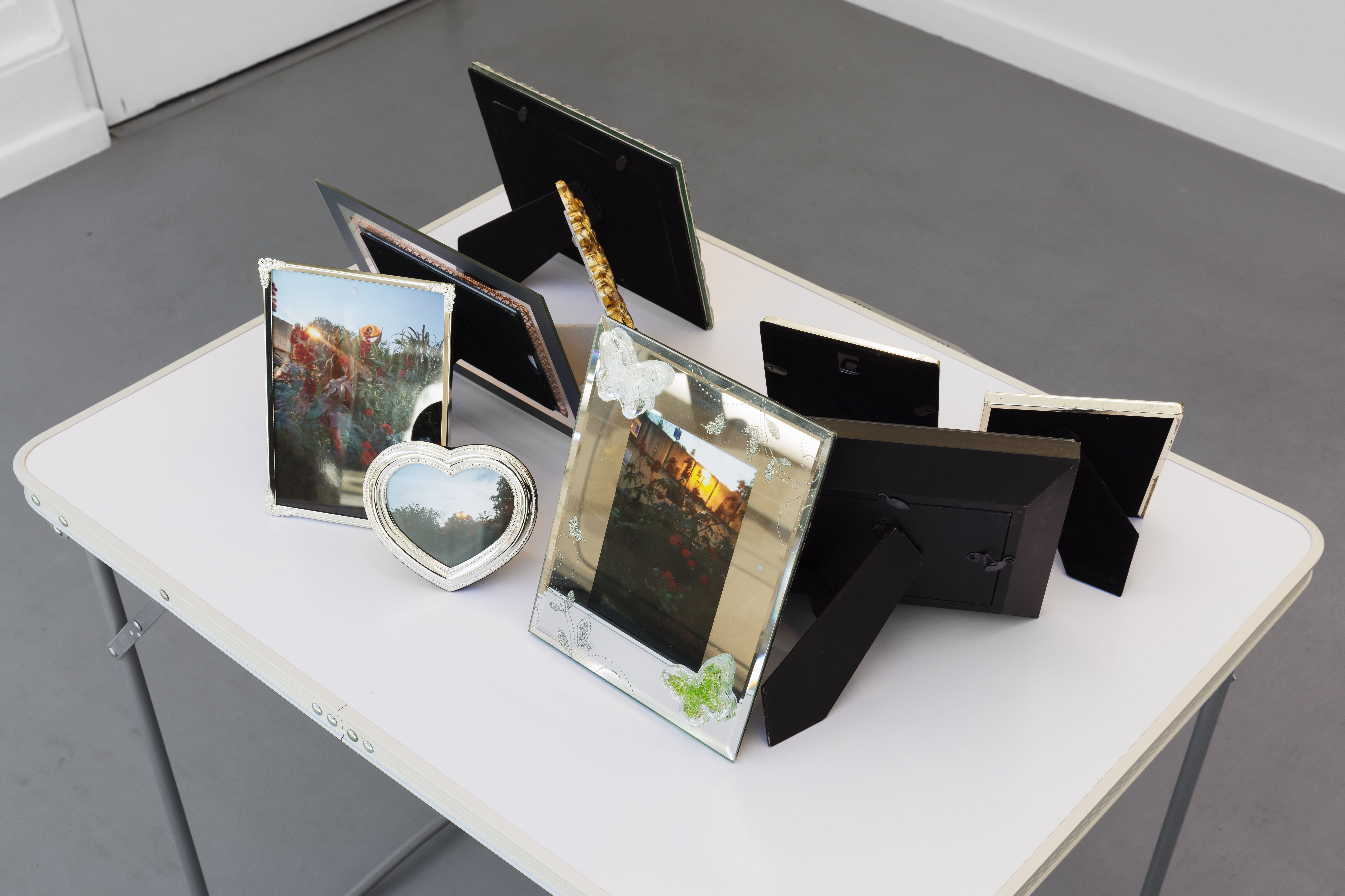 Hélène Fauquet, Flower composition photographs interpreting the theme of Mordor, Lothlórien and the Shire II, 2021–2022, table, framed photos 70 × 80 × 60 cm. Courtesy of the artist and Damien & The Love Guru. Photography by Useful Art Services