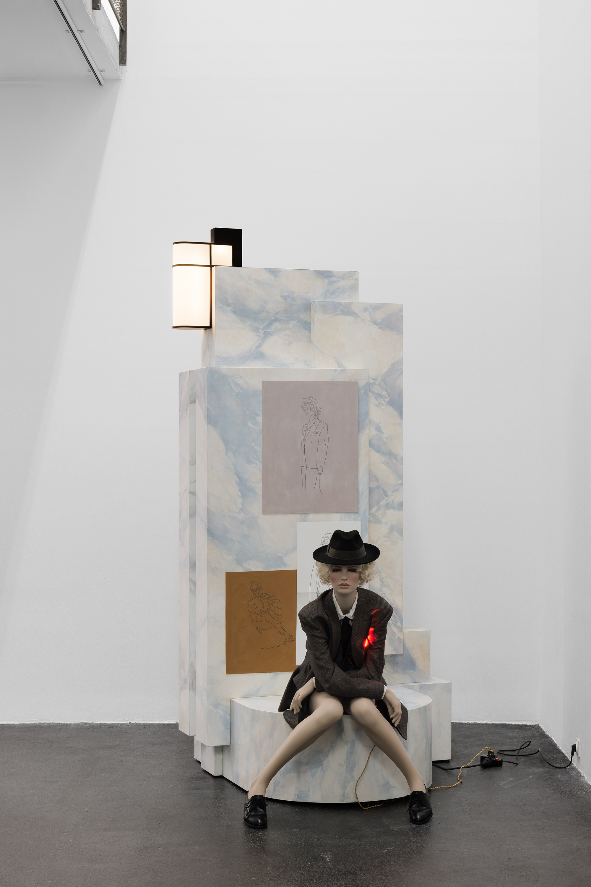 Installation view, Lucy McKenzie: Plastic Newspaper (2026), Crac Occitanie, Sète. Monumental Streetlamp / 1938 Duchamp Mannequin Sketches, 2017–2024. Oil on wood, metal, glass and light, 250 × 95 × 131 cm. Duchamp Mannequin, 1938 (III), 2025. Fibreglass mannequin, clothing, wig and electric lamp. Courtesy of the artist and Cabinet Gallery, London. Photo: Useful Art Services.