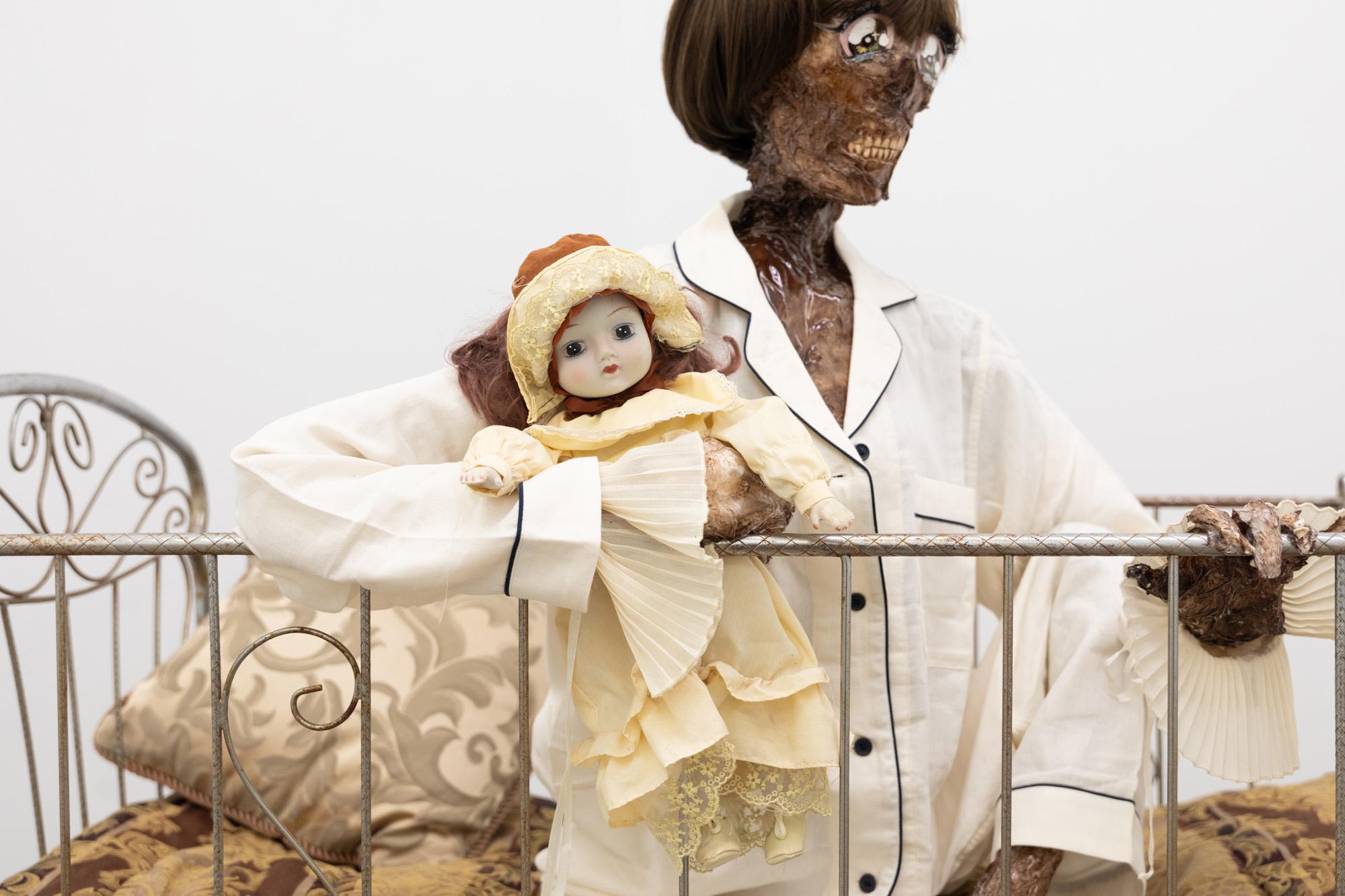 JULIEN CECCALDI, Growing up Gay, 2026 Crib, comforter, plastic skeleton, melted drop cloth, wood stain, wig, acrylic paint on duralar, fake eyelashes, pyjama, and video game controller. Courtesy of the artist and Cooper Cole.