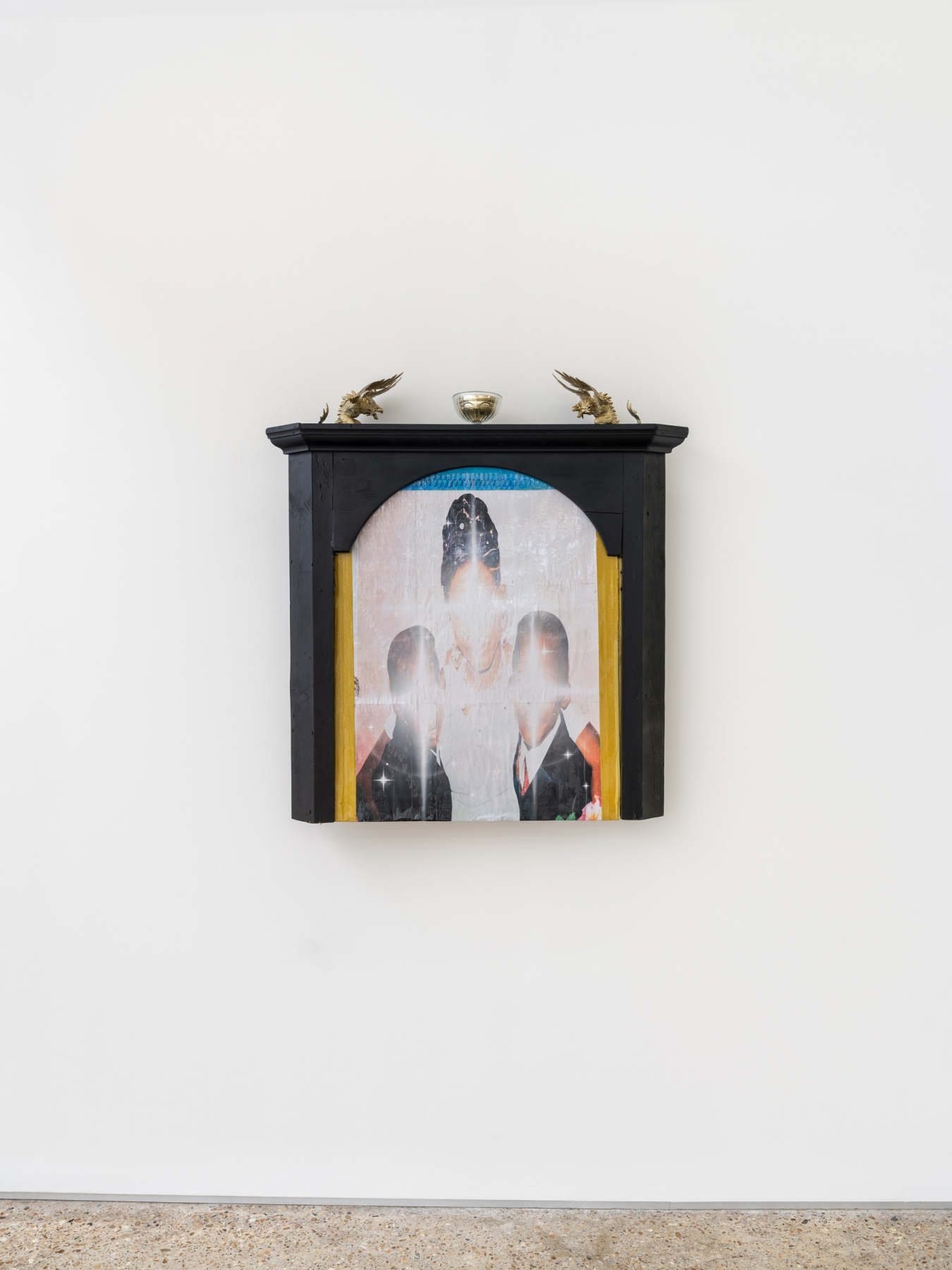 Ladji Diaby, Jour de fête, 2026, wood, laser print, adhesive tape, aerosol spray, toy, cup, 110 × 103 × 20 cm. Courtesy of the artist and Crèvecœur.
