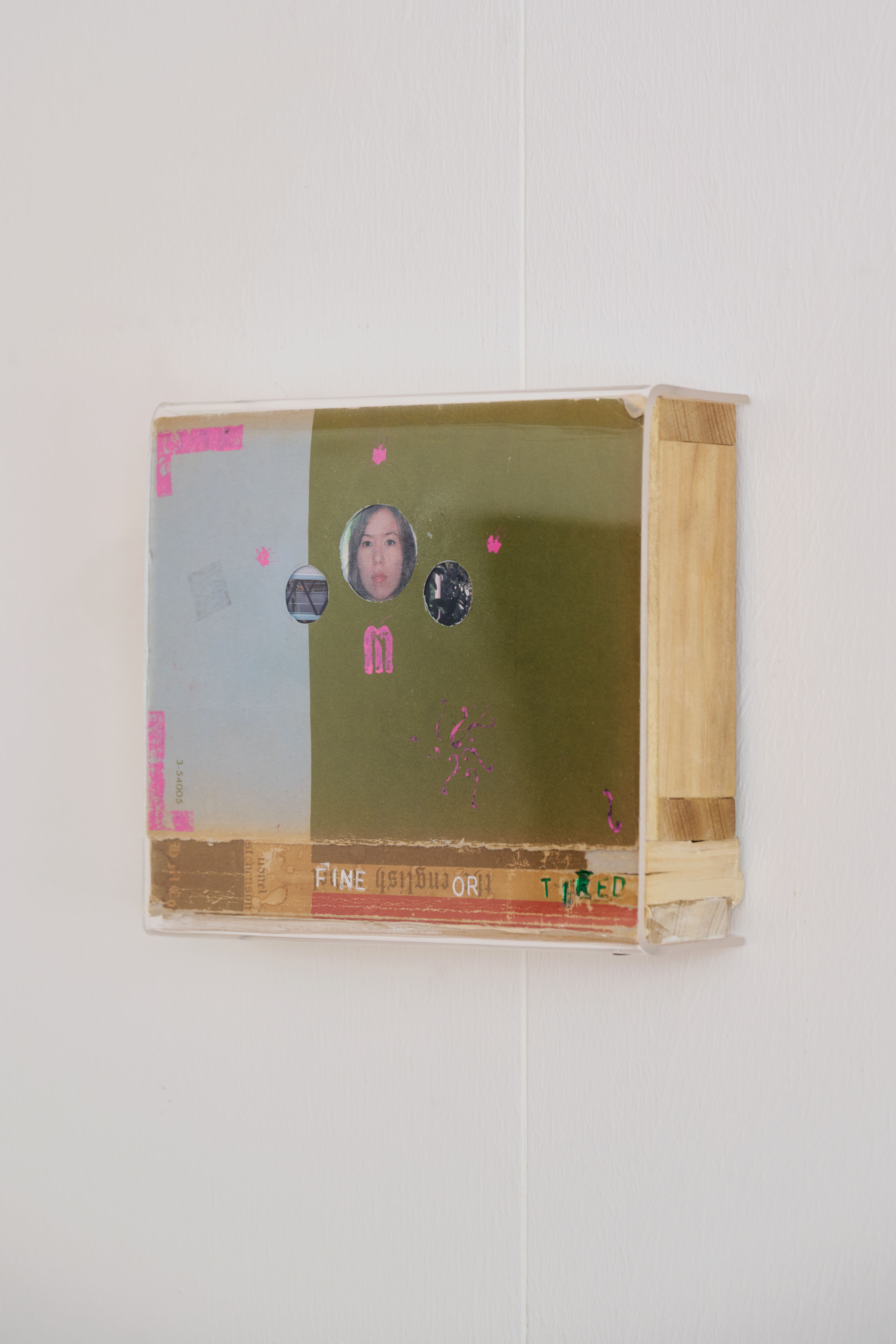 Marisa Kriangwiwat, Richmond, 2026, Acrylic, oil woodblock print ink, pine, used book, and 2013 Canadian passport biodata page, 2010 chromogenic glossy print on Kodak RC paper, 21.5 × 18 × 5 cm. Courtesy of the artist and Double.