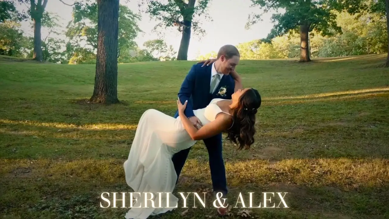 Sherilyn and Alex share a romantic dance pose in a sunlit park setting, surrounded by trees. The bride wears a white dress, while the groom is in a blue suit. Their names are displayed at the bottom of the image in an elegant font.