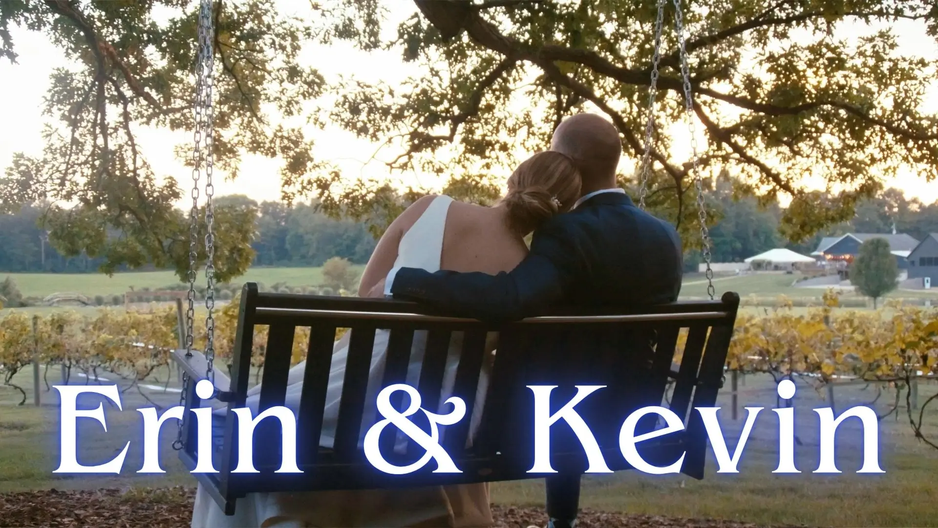 Erin and Kevin sit closely on a swing at Westers Family Winery, enjoying the scenic vineyard and countryside view. "Erin and Kevin" is written in large text at the bottom.