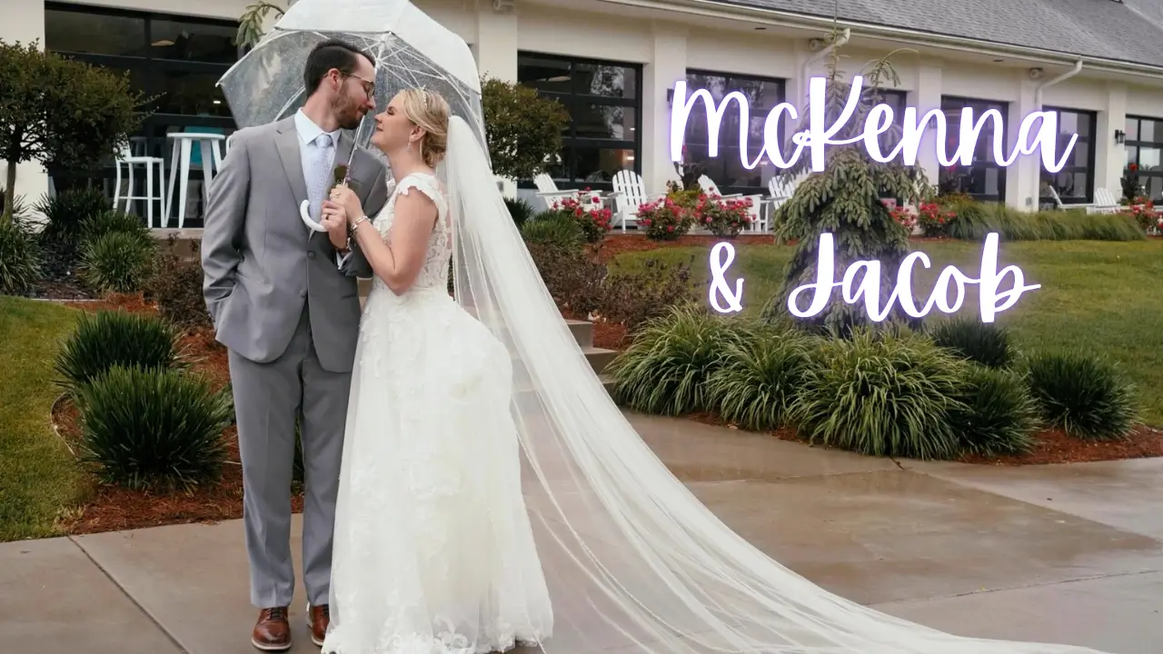 Bride in a lace gown and groom share a romantic kiss under a clear umbrella outside Railside Golf Club; white script text on the right reads "Mckenna & Jacob."