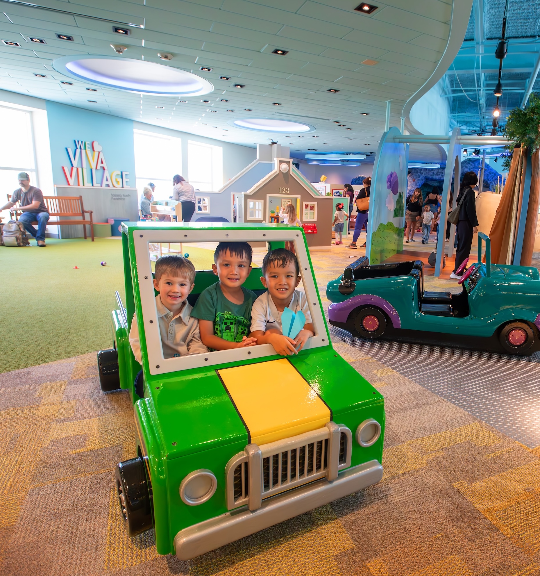 children in toy truck 