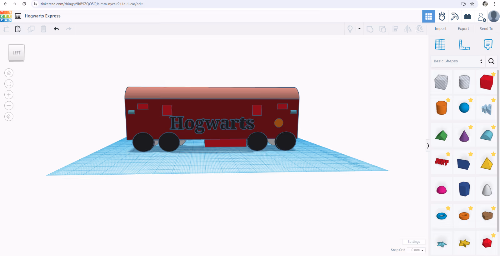 A red train on a blue surfaceDescription automatically generated
