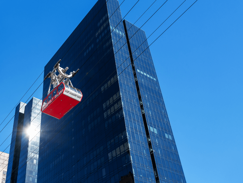 An image of a skyliner crossing over the New York skyline