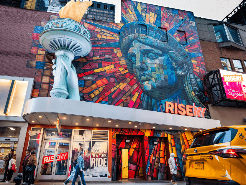 The outside of RiseNY showing the iconic Statue of Liberty mural