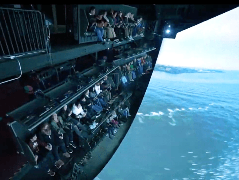 An interior shot of people enjoying and riding the RiseNY attraction.