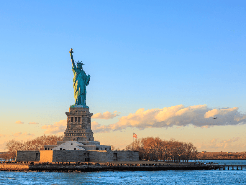 A picture of the Statue of Liberty during sunset
