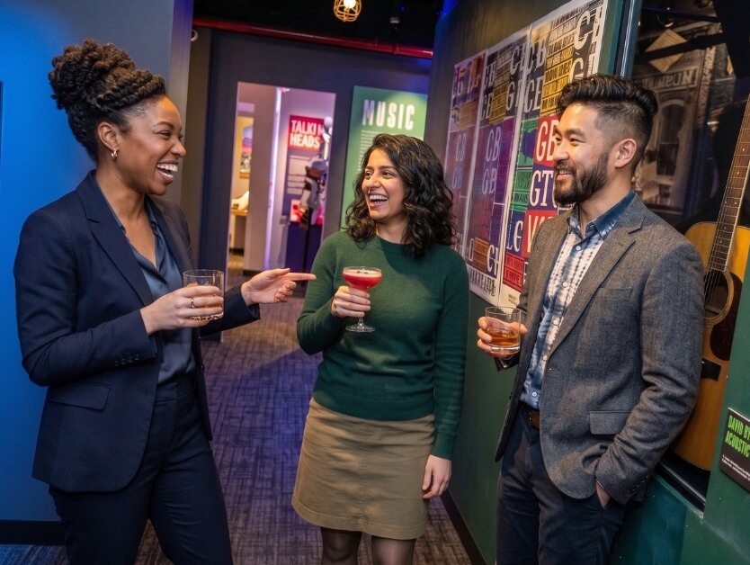 People enjoying a cocktail hour in one of the many exhibit rooms at RiseNY