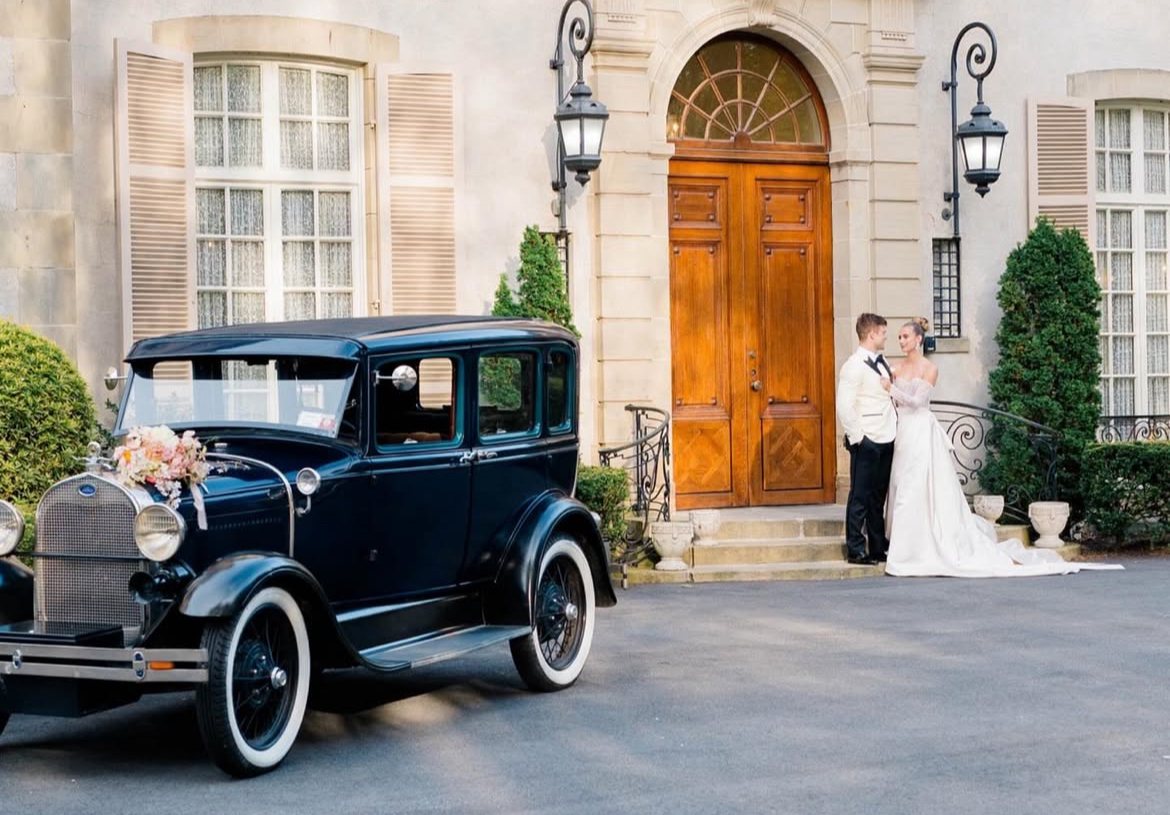 Close-up of 1929 Ford Model A Deluxe with ocean backdrop in Newport, RI – antique car rental by Newport Classic Car Co. for weddings, coastal photo shoots, and private events.