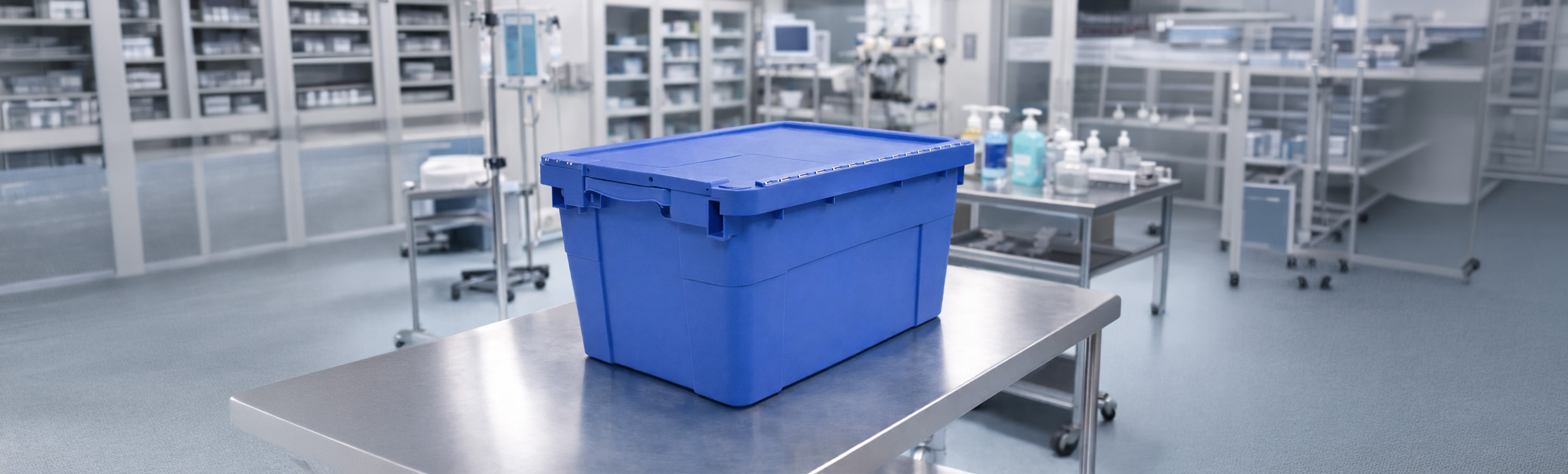 Blue medical loaner kit box on a stainless steel hospital trolley