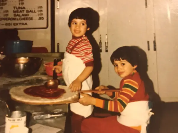 SEBASTIANO LUCIANNO AND DOMENICO LUCIANNO AS TWO YOUNG TEENAGE BOYS HELPING THEIR FATHER MAKE PIZZA