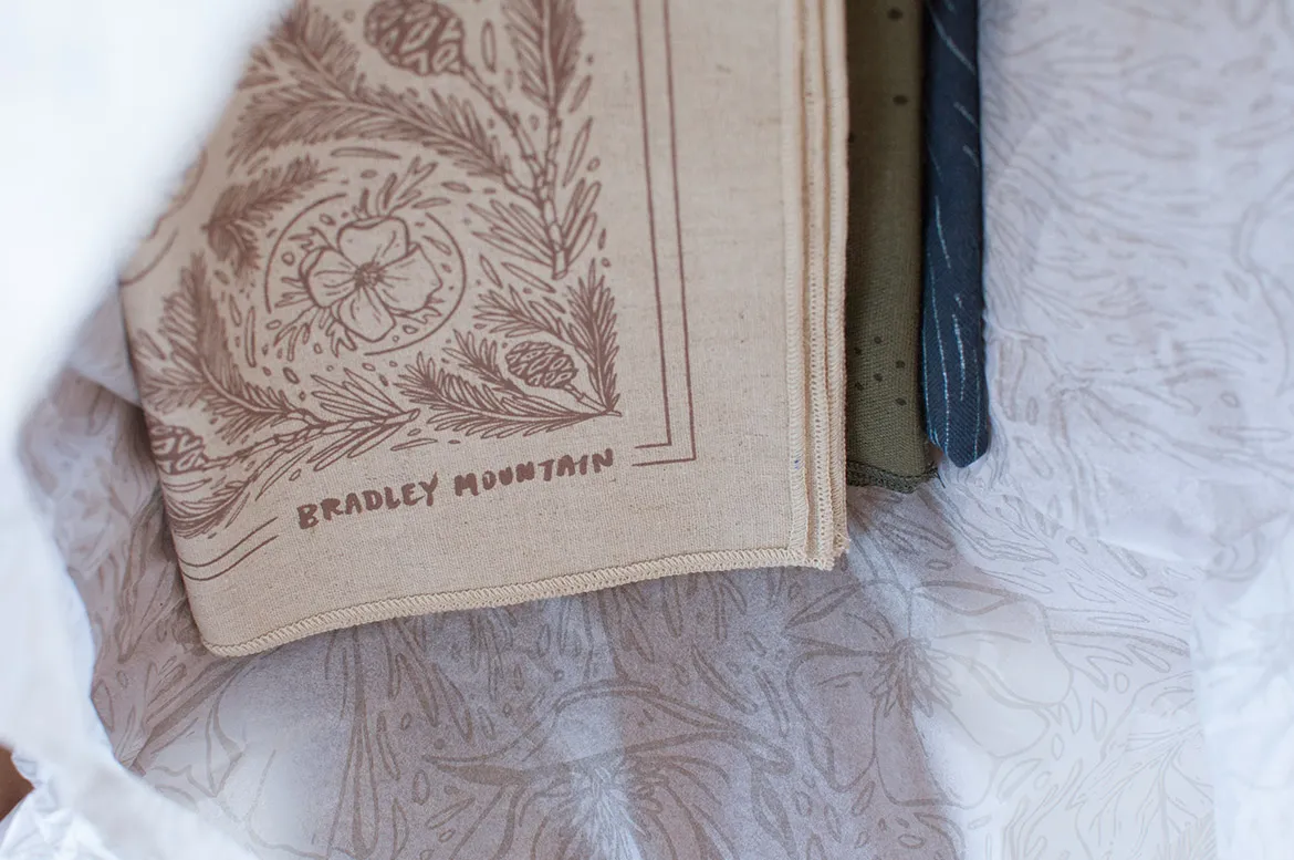 Bradley Mountain bags wrapped in the illustrated bandanas