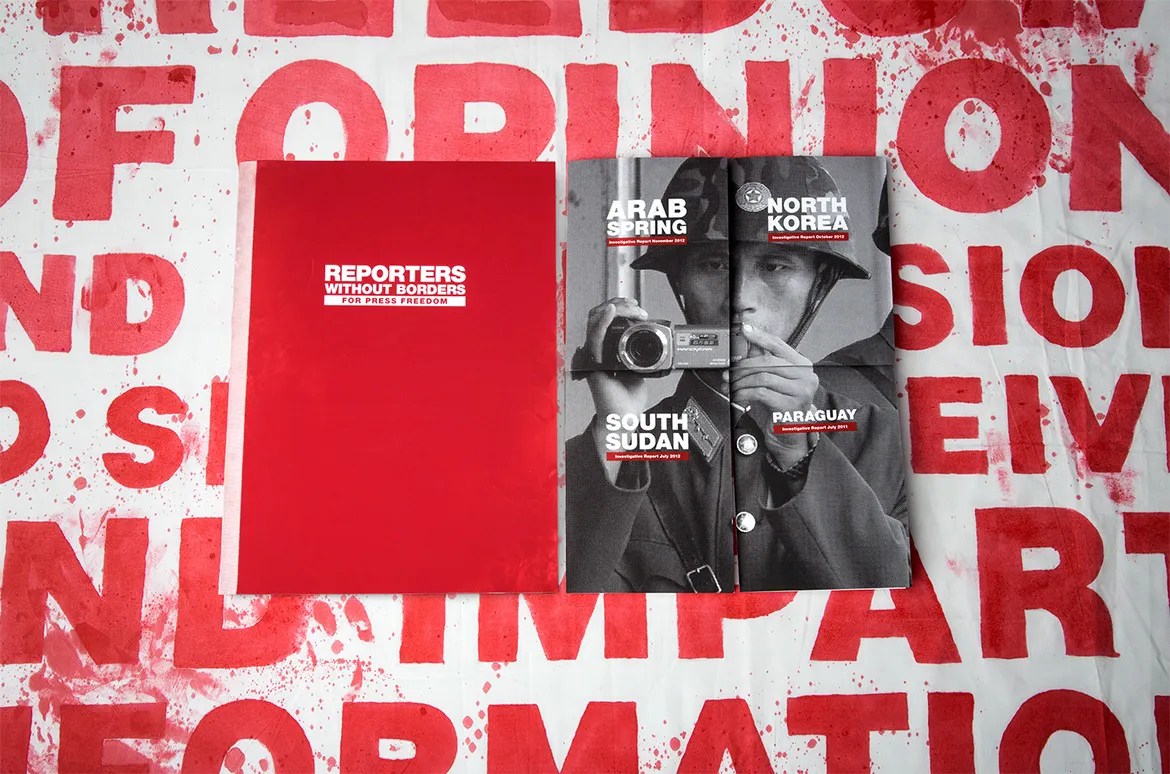 The journalist's survival kit folio, unwrapped across a desk