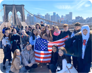 A group of students on a study tour with american flag in their hand