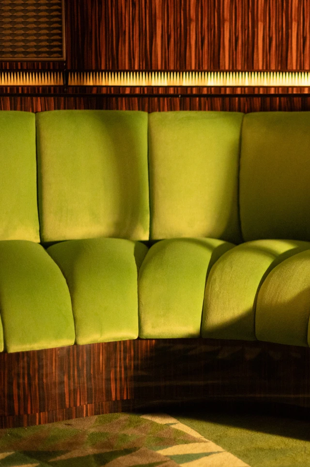 Green bar car banquette on board of the bar car of L'Orient Express