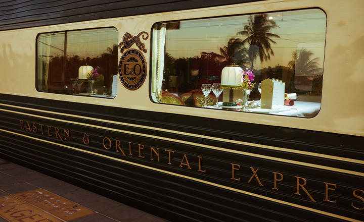 A shot of the Eastern and Oriental Express' train window, taken from a train station platform.