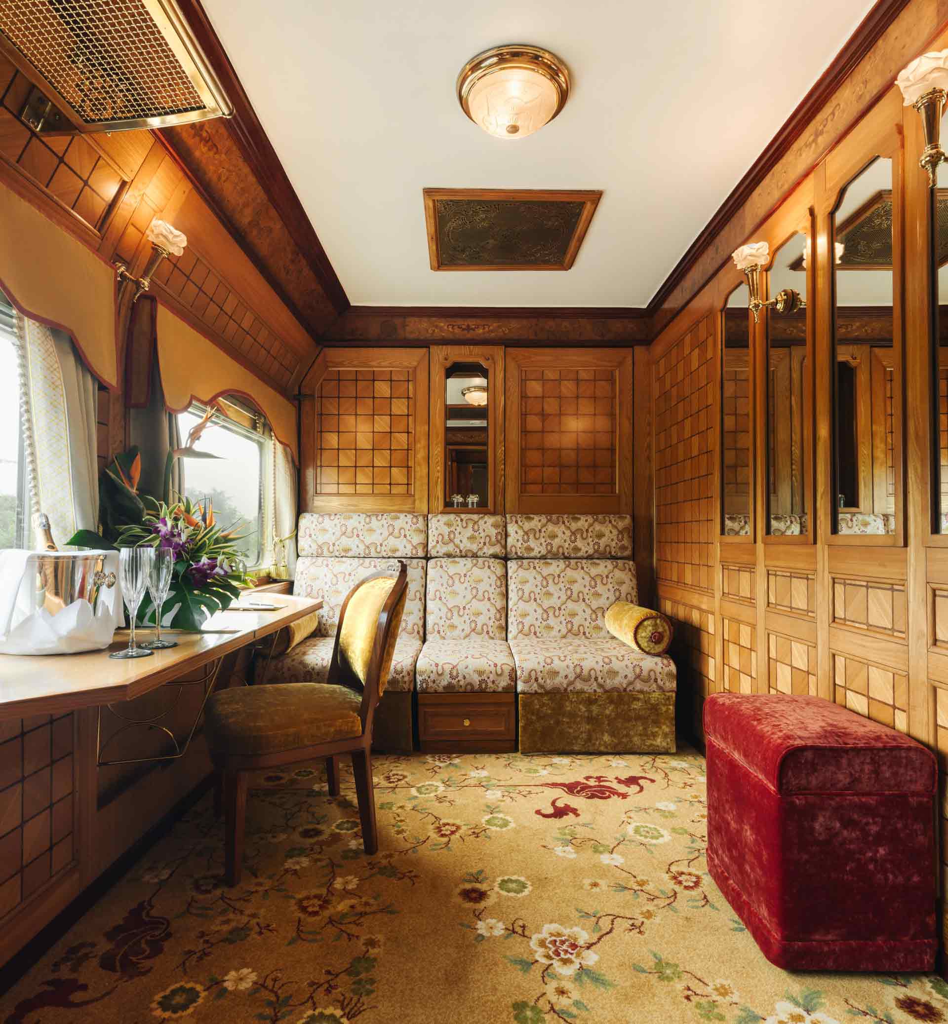 Eastern and Oriental Express' Presidential Suite during the day. Fitted with seating.
