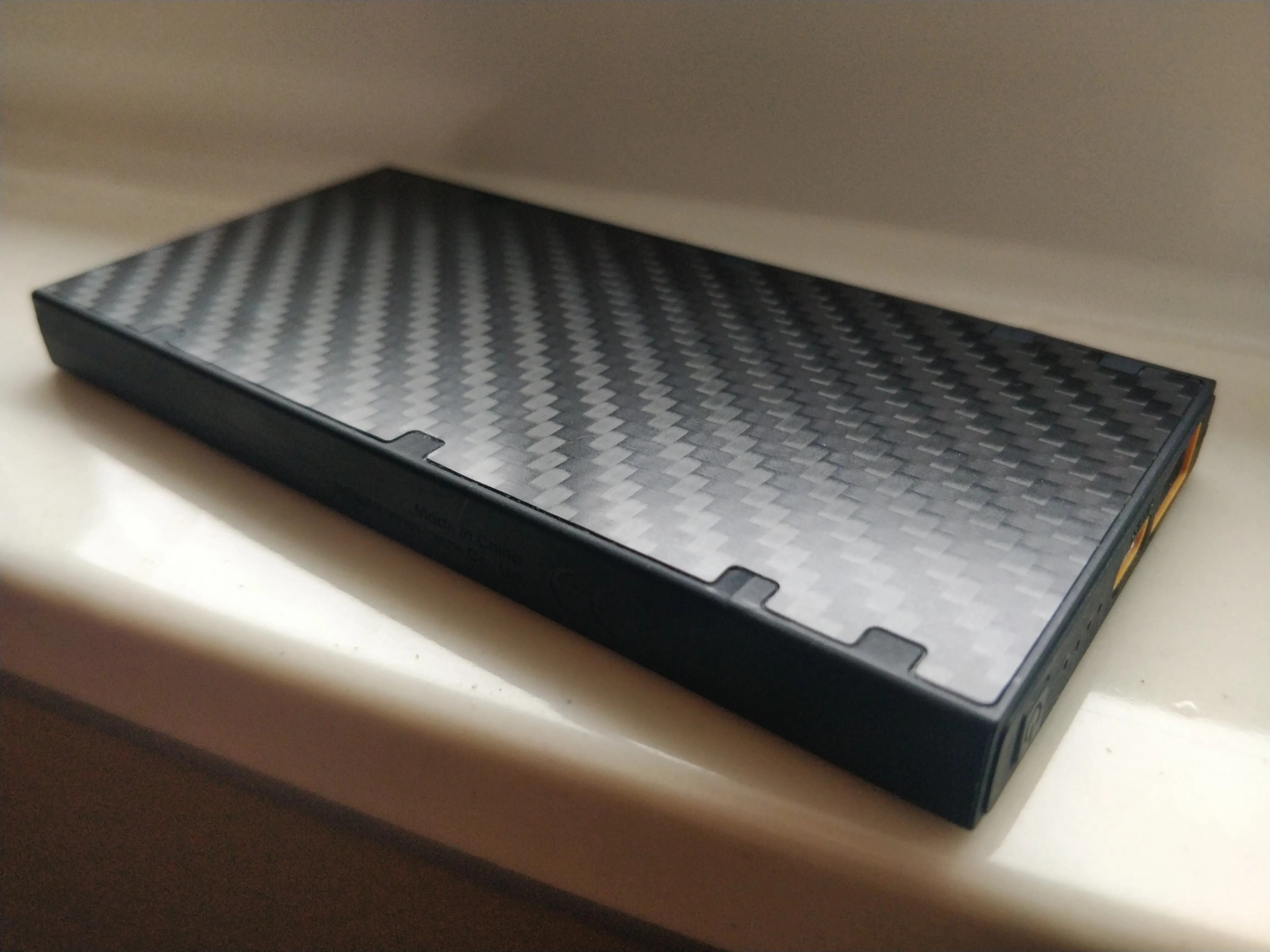 The Nitecore NB1000 on a ledge