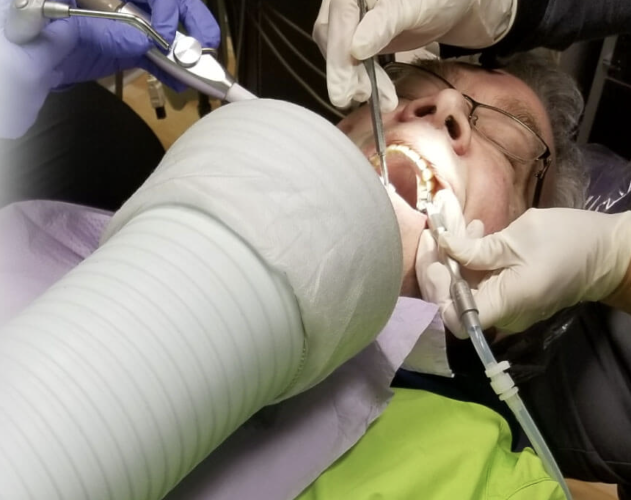 dental hygienist talking and laughing with a patient