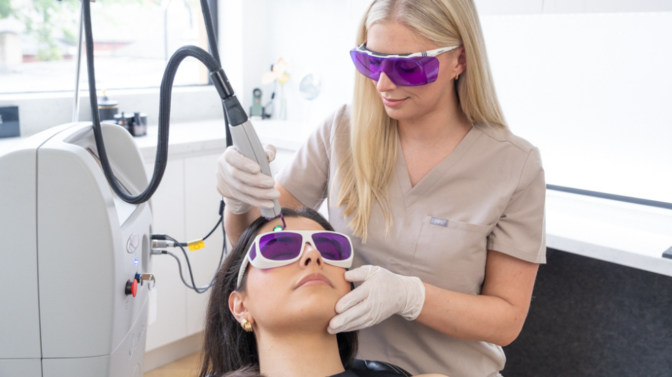 A trained skin specialist uses advanced laser technology to target freckles at the Victorian Dermal Group clinic.